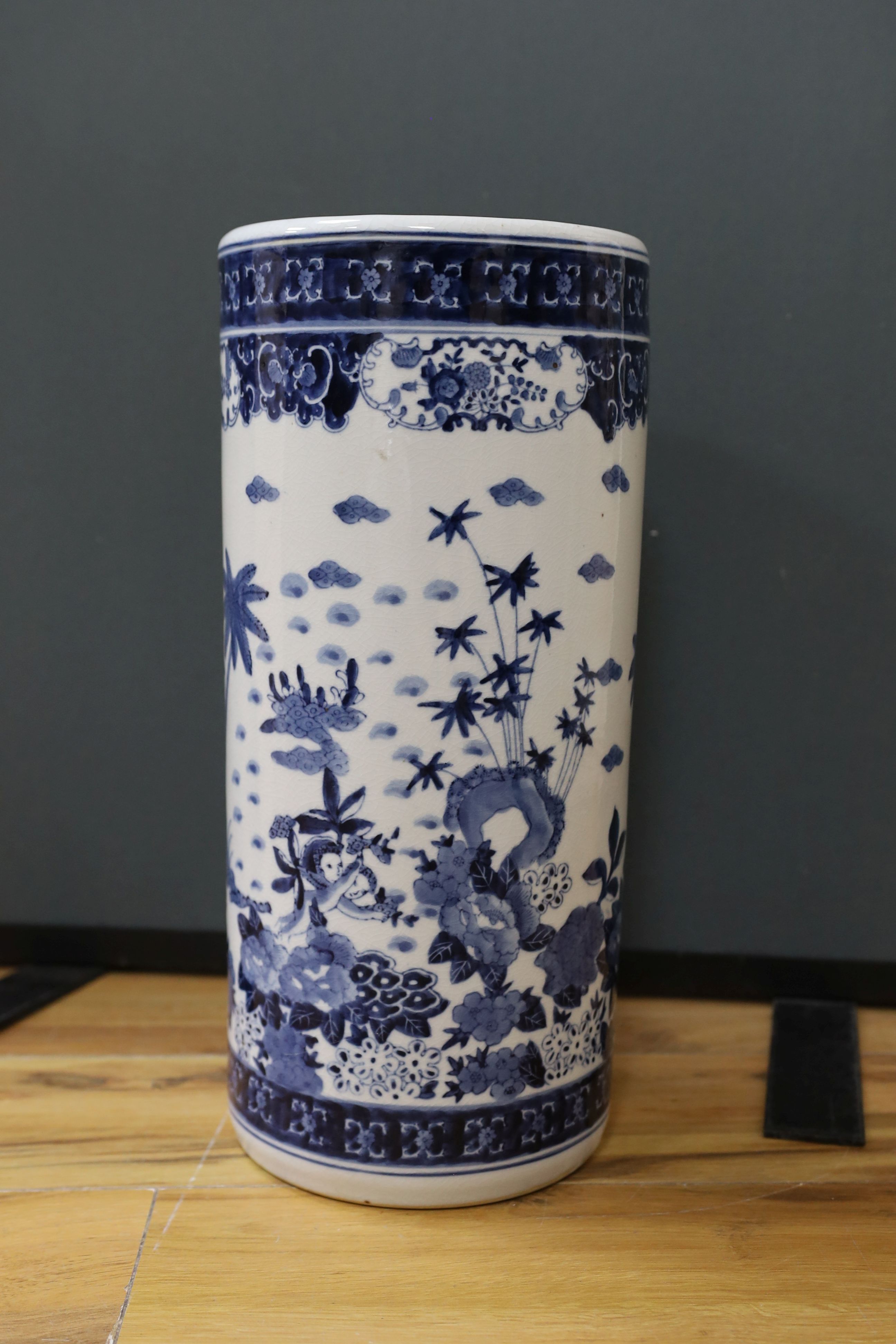 A Chinese blue and white cylindrical stick and umbrella stand, 44cm